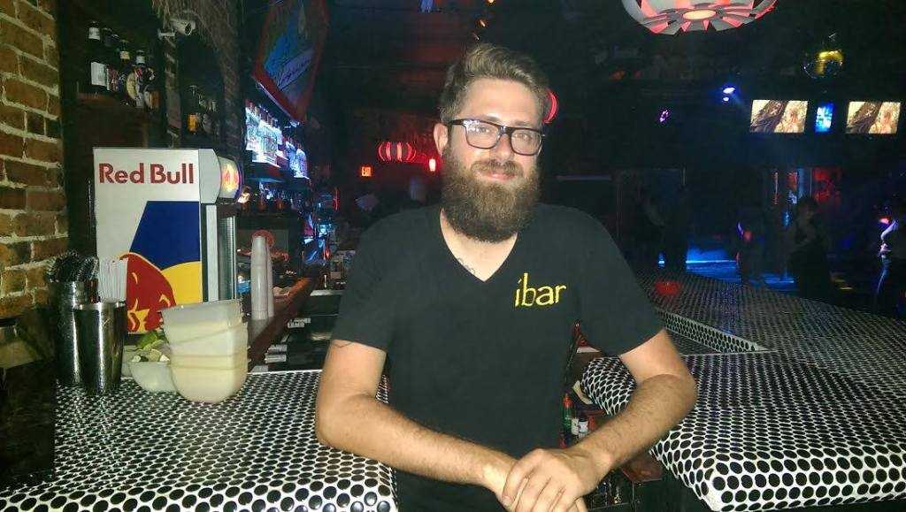 Preston behind the dance floor bar.